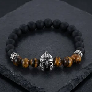 Detail of Spartan helmet charm and tiger eye stones on a men's beaded bracelet
