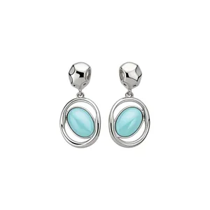 Elegant silver earrings with oval light blue acrylic pendants and hammered metal studs.