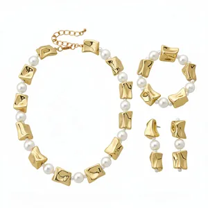 Vintage pearl jewelry set with crumpled gold square beads, necklace, bracelet and earrings.