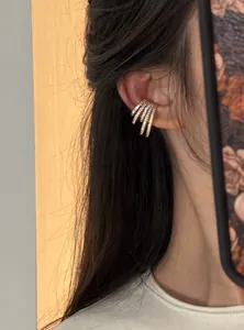 Close-up view of elegant four-layer zircon ear cuff jewelry for non-pierced ears style