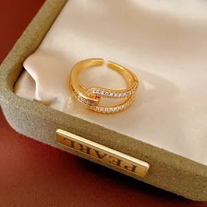 Detailed view of 18k gold plated ring featuring geometric hollow design with zircon