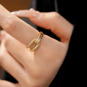 Detailed macro view of an 18k gold plated geometric open ring with sparkling zircons