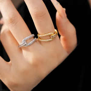Close-up view of elegant 18k gold plated geometric hollow rings with cubic zirconia