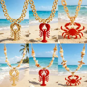 Bohemian ocean theme lobster and crab pendant necklaces with pearls and gold chains.