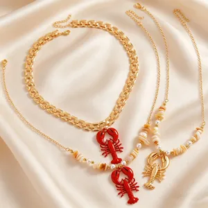 Close-up view of bohemian style lobster pendant necklaces with shells and faux pearls