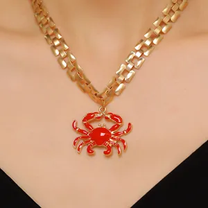 Gold watchband chain necklace with red enamel crab pendant fashion accessory