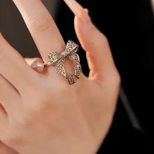 Detailed view of an elegant silver bowknot ring with an intricate openwork design