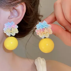 Handmade colorful resin flower earrings with yellow globes for a sweet dopamine style look