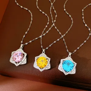 Detail of sparkling star pendant necklaces with pink, yellow and blue cubic zirconia stones