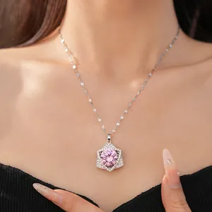 Close-up of elegant pink zircon star pendant necklace on a model's collarbone