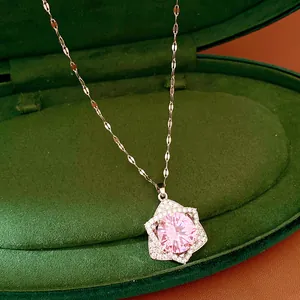 Close-up of elegant star pendant necklace featuring a brilliant pink zircon gemstone