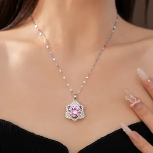 Elegant pink zircon hexagram pendant necklace shown as a close-up on a model's neck.
