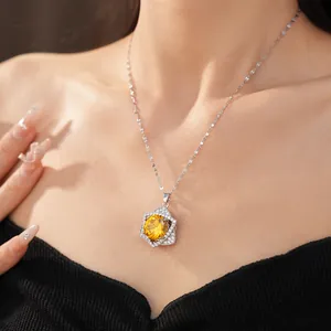 Detailed macro view of star-shaped pendant with yellow zircon on elegant silver chain