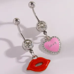 Detailed view of pink heart and red lip belly rings with shimmering zircon accents.