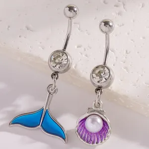 Detailed view of enamel mermaid tail and purple shell belly button rings with pearls