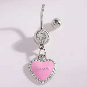 Detailed view of pink enamel heart navel ring with Love engraving and clear CZ stone