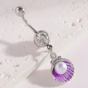 Close-up macro detail of silver belly button ring featuring purple shell and pearl pendant