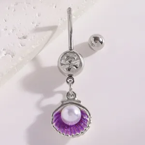 Detailed macro view of a silver shell belly button ring with purple enamel and a pearl