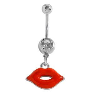 Macro detail of red lips pendant belly button ring with clear sparkling gem inlay