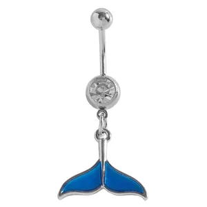 Detailed macro view of a silver belly button ring featuring a blue enamel whale tail pendant