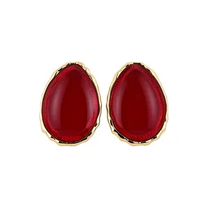 Vintage red teardrop resin stud earrings with elegant gold-toned textured frame