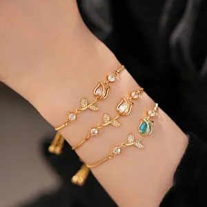 Elegant gold tulip adjustable bracelets with pink white and blue cubic zirconias