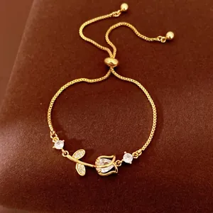 Elegant gold tulip flower bracelet with sparkling zircon stones and adjustable sliding clasp