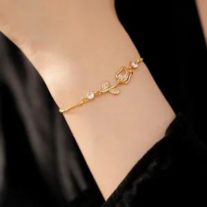 Elegant gold tulip bracelet featuring pink zircons on an adjustable drawstring chain