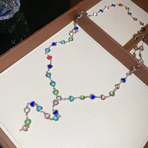Close-up detail of vibrant dopamine multi-color crystal heart Y-shaped necklace for women