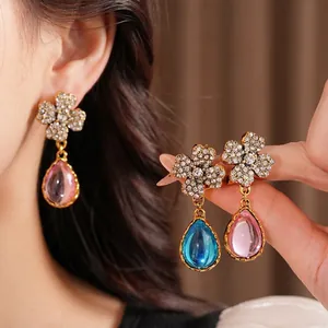 Elegant vintage flower stud earrings with rhinestones and pink resin teardrop pendants