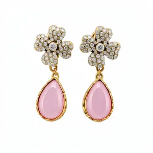 Elegant vintage-style flower earrings with pink teardrop resin and crystal embellishments.