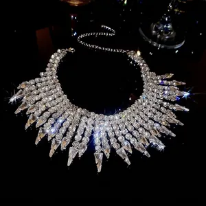 Close-up of luxury silver rhinestone fringe necklace with sparkling teardrop crystals.