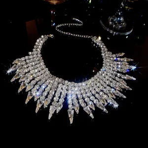 Detailed view of luxury rhinestone fringe necklace with shimmering water-drop tassels.