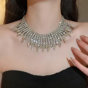 Detailed close-up of a luxurious layered rhinestone tassel necklace with sparkling crystals.