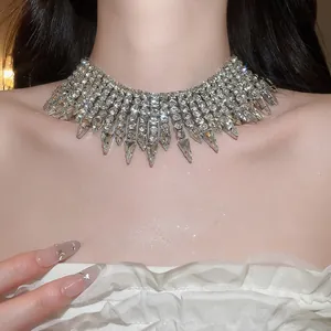 Close-up detail of luxurious rhinestone fringe choker necklace on model
