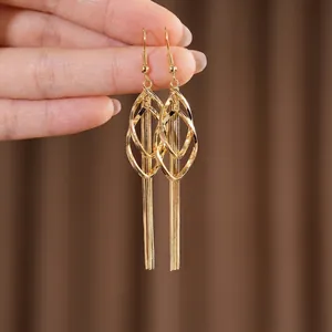 Elegant golden water-drop geometric hollow earrings with long tassels for women fashion