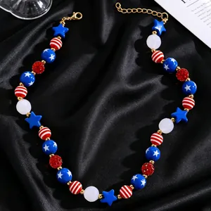 Detail of USA flag themed necklace with red, white, and blue beads on black silk