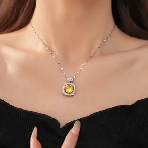 Elegant silver necklace featuring a square pendant with a brilliant yellow zircon stone