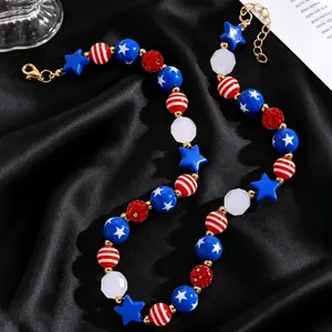 Detail of USA flag themed beaded necklace with stars and stripes on black silk fabric