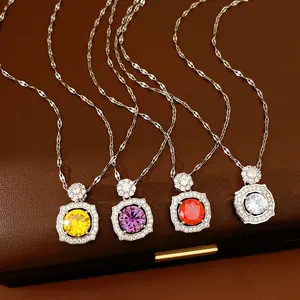 Detailed view of four colorful zircon necklaces featuring elegant geometric square pendants