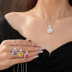 Detail view of silver zircon necklaces with vibrant purple, yellow, red, and white stones.