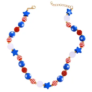 Macro detail of red white and blue beaded necklace with stars and gold lobster clasp
