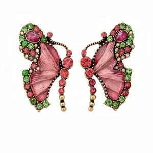 Vintage butterfly jewelry set with pink resin wings and colorful rhinestones