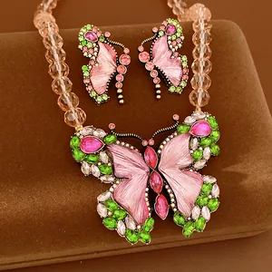 Vintage beaded jewelry set with colorful rhinestone butterfly pendant and earrings