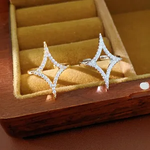 Elegant 18k gold plated zircon four-point star open rings presented in a wooden jewelry box