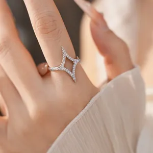 Macro view of an elegant 18k gold plated star open ring inlaid with sparkling zirconia