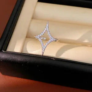 Close-up detail of a sparkling zircon starburst open ring inside a luxury jewelry gift box
