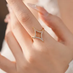Detail view of an 18k gold plated star open ring with shimmering micro-set zircon stones