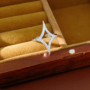 Close-up of elegant silver star ring with shimmering zircons in a jewelry box