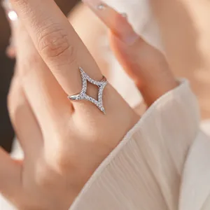 Detailed close-up of an 18k gold-plated star ring with shimmering cubic zirconia.